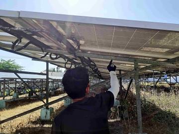 NZMATES Renewable Energy Technical Specialist checking the solar power plant testing list in Tahalupu