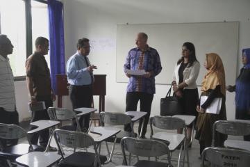 The Dean of the Engineering Faculty shows the Embassy delegation around the site of Pattimura University's future solar lab, in development with support from NZMATES.