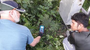 NZMATES Technical team conduct a safety check, checking the solar array framing and combiner boxes for live voltage