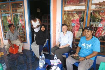 A reliable, 24-hour electricity service can bring great benefits to small business owners like this woman, who runs a small kiosk